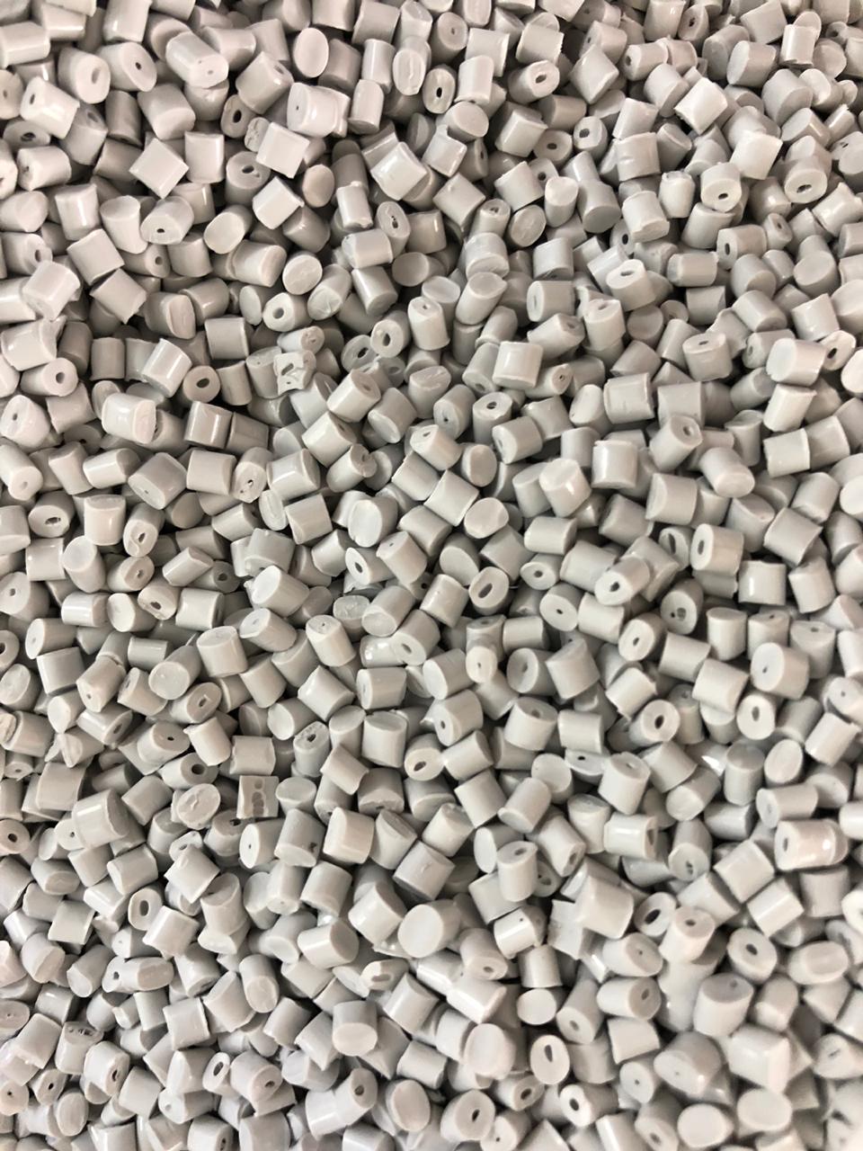 Close-up of white recycled ABS plastic pellets